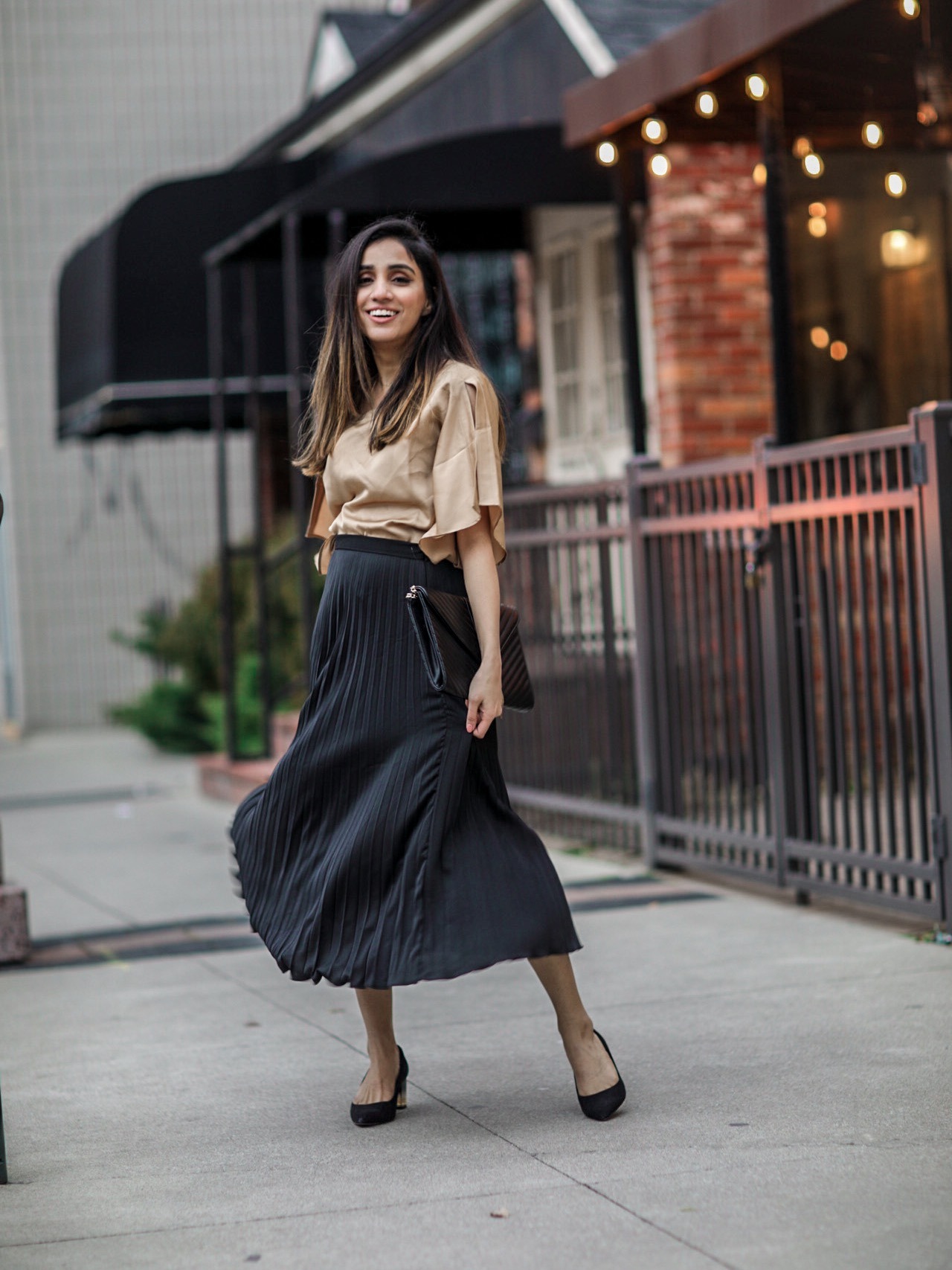 Holiday Outfits Roundup 2019 black pleated skirt fluid satin slit-sleeve blouse Faiza Inam 2