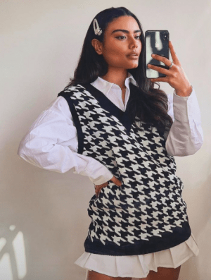 TikTok Fashion Trends We Are All Obsessing Over white mini pleated skirts oversized sweater vests 1