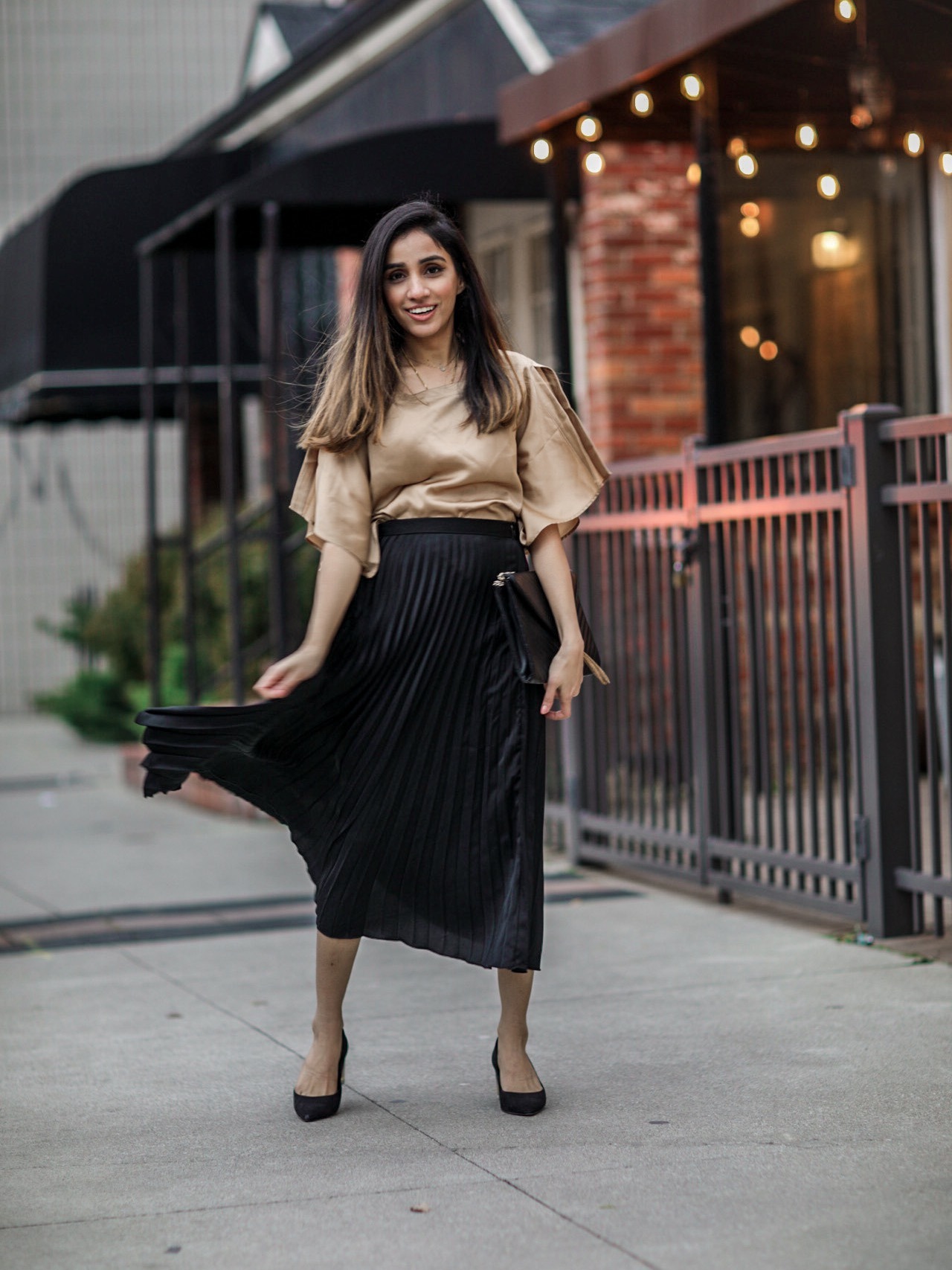 What to Wear at Thanksgiving Family Dinner pleated skirt black silk blouse 2